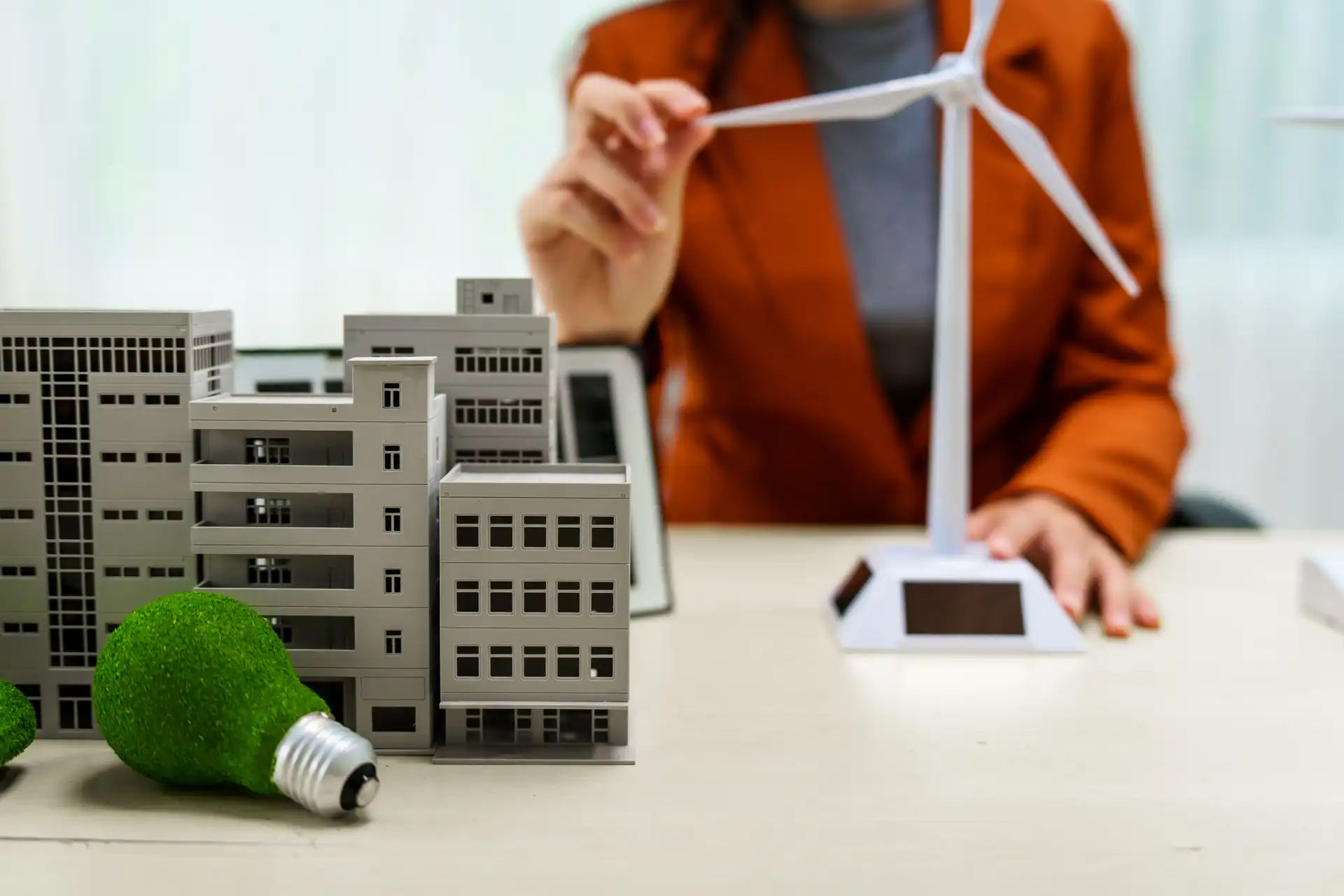 a businesswoman in a brown suit stands at a white 2024 07 15 23 07 28 utc